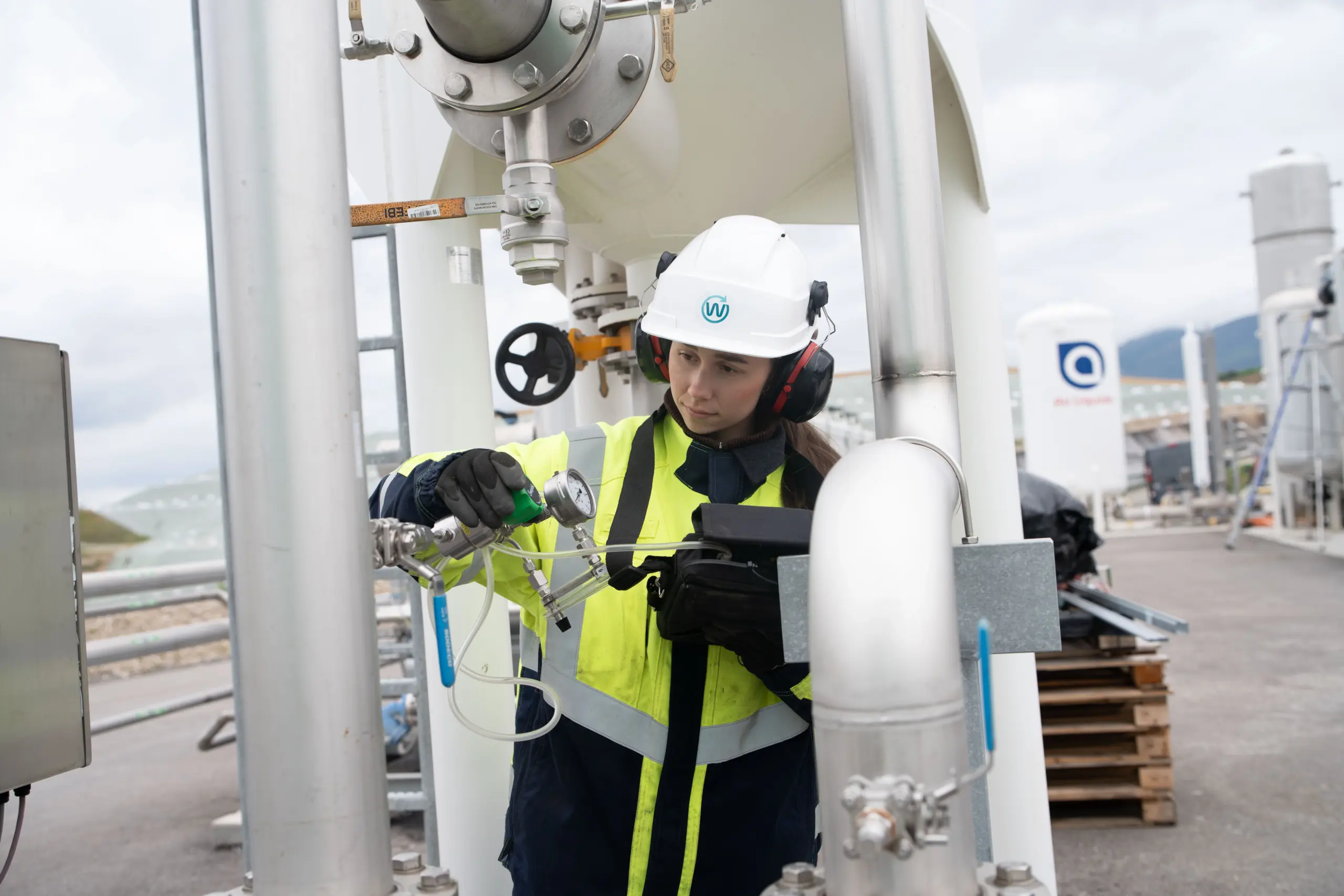 Maintenance technician performing an inspection on instrumentation and piping systems at a WAGABOX® facility.